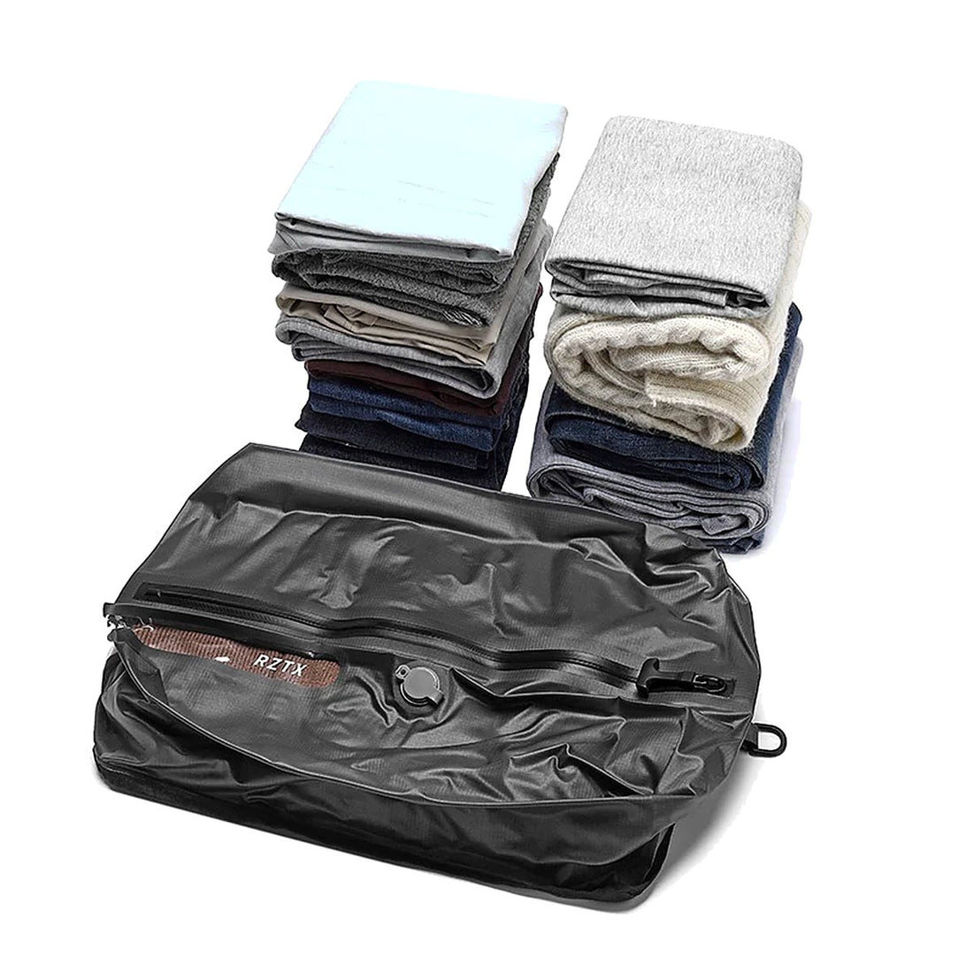 Folded clothes next to the Auralane vacuum compression bag